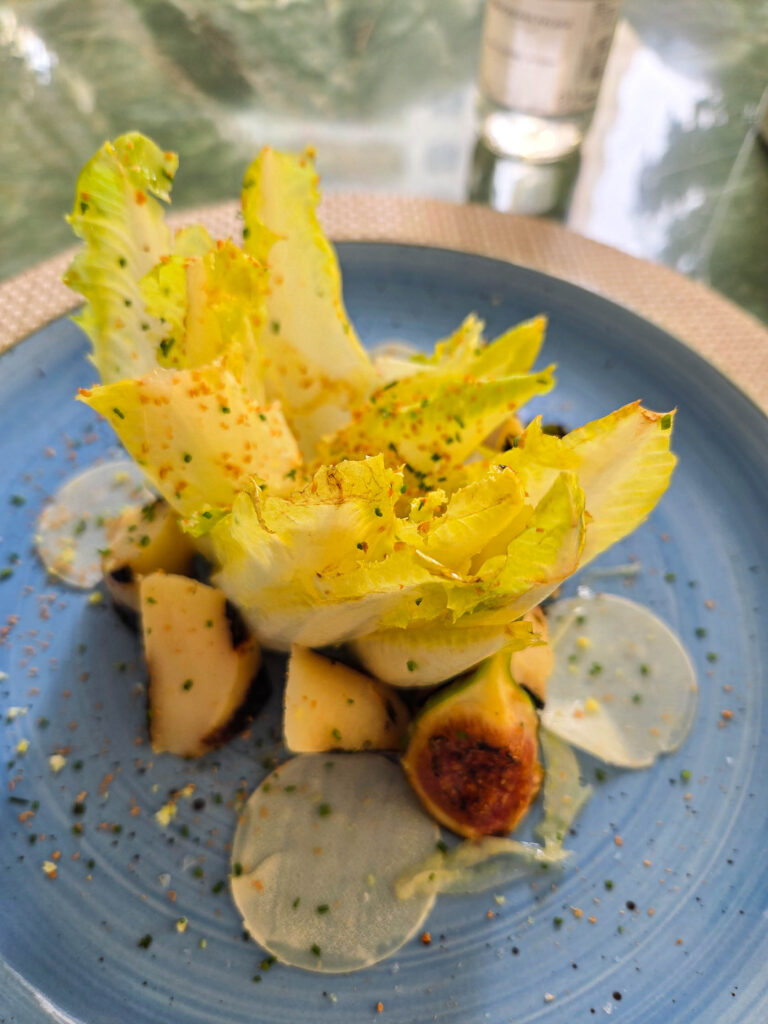 Seasonal endive salad served on a blue ceramic plate at Belmond Copacabana Palace, Rio de Janeiro luxury hotel ©Stephanie Dosch | theViatrix Luxury Travel