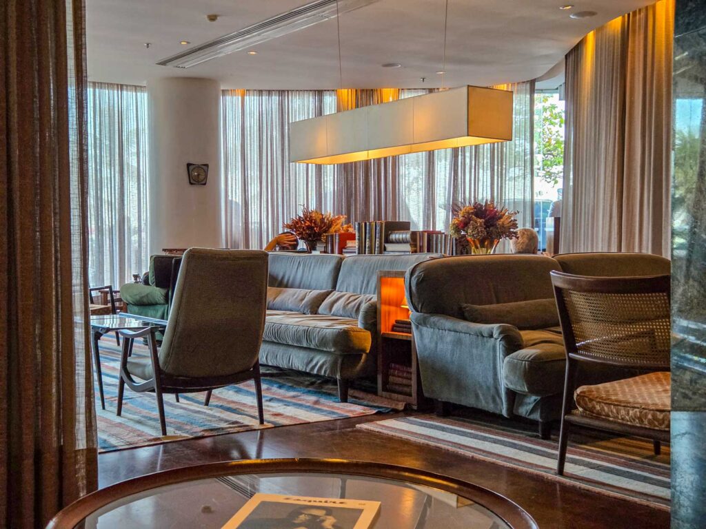 Cozy guest lounge with mid-century furniture and soft lighting at Hotel Fasano, one of the most stylish luxury hotels in Rio de Janeiro ©Stephanie Dosch | theViatrix Luxury Travel