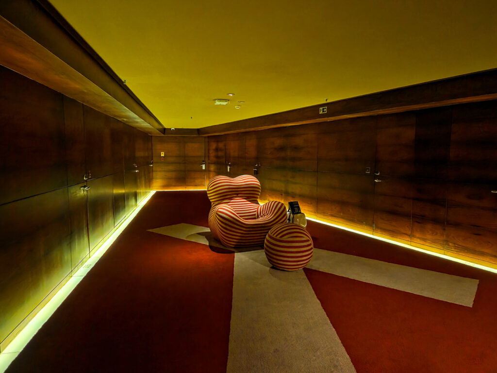 Contemporary hallway with iconic striped armchair installation at Hotel Fasano in Rio de Janeiro ©Stephanie Dosch | theViatrix Luxury Travel