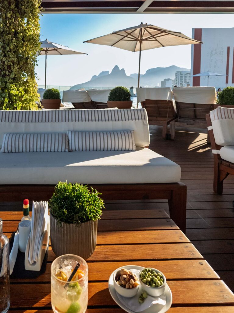 Signature cocktail and snacks on rooftop terrace at Hotel Fasano with views of Ipanema Beach and Two Brothers Mountain ©Stephanie Dosch | theViatrix Luxury Travel