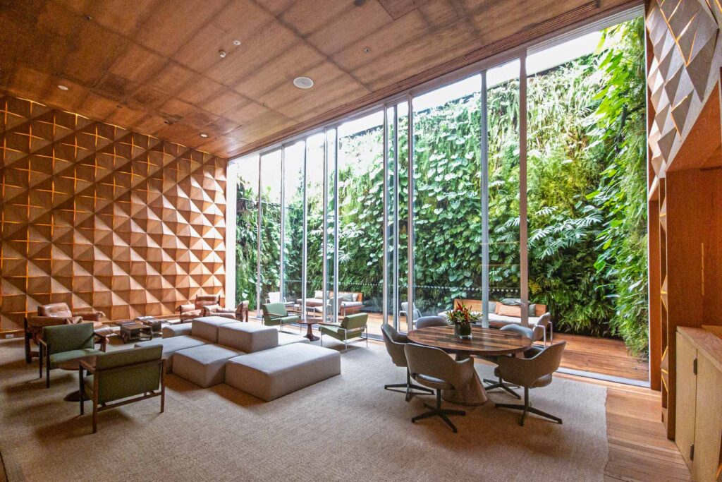 Modern lounge with mid-century furnishings and vertical garden at Emiliano Rio, a boutique luxury hotel in Rio de Janeiro ©Stephanie Dosch | theViatrix Luxury Travel