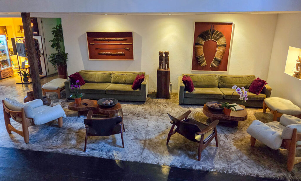 Lobby lounge with mid-century seating and curated Brazilian art at Santa Teresa Hotel RJ - MGallery, a luxury hotel in Rio de Janeiro ©Stephanie Dosch | theViatrix Luxury Travel