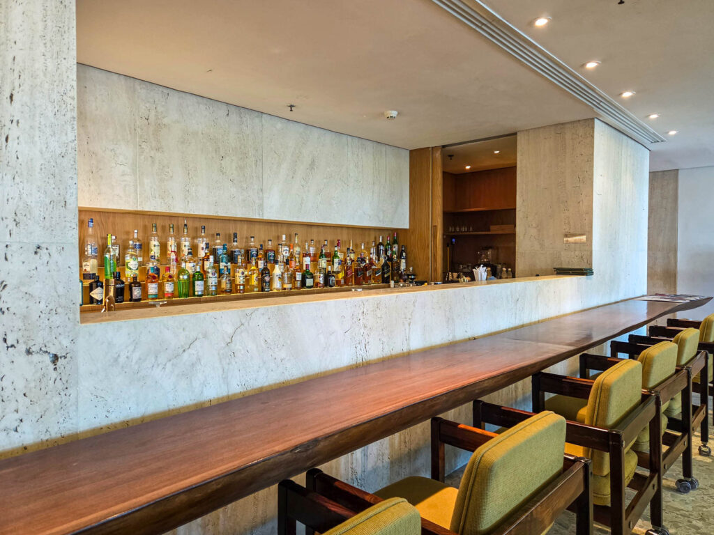 Minimalist marble bar with curated spirits selection at Emiliano Rio, boutique luxury hotel in Brazil ©Stephanie Dosch | theViatrix Luxury Travel